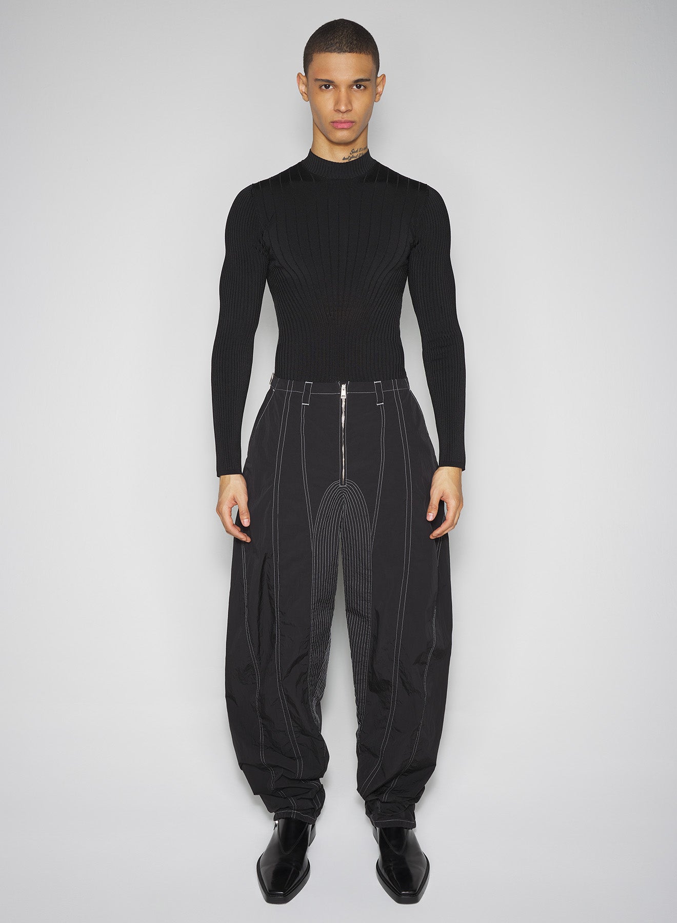 black stitched parachute pants