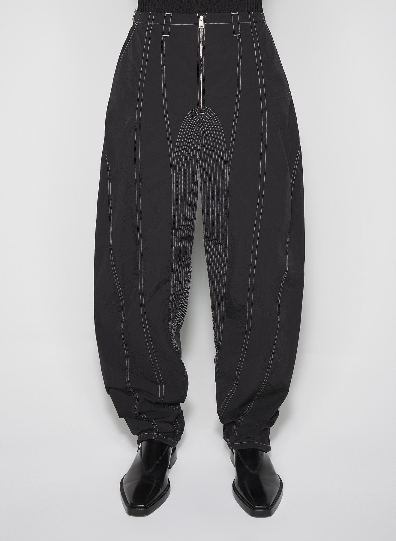 black stitched parachute pants