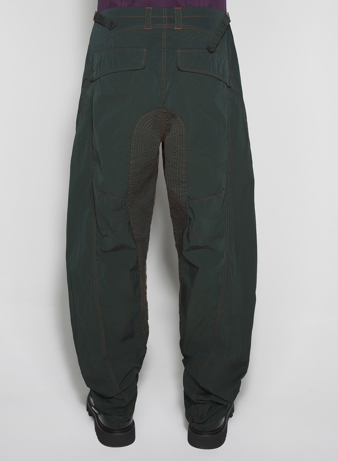 green stitched parachute pants