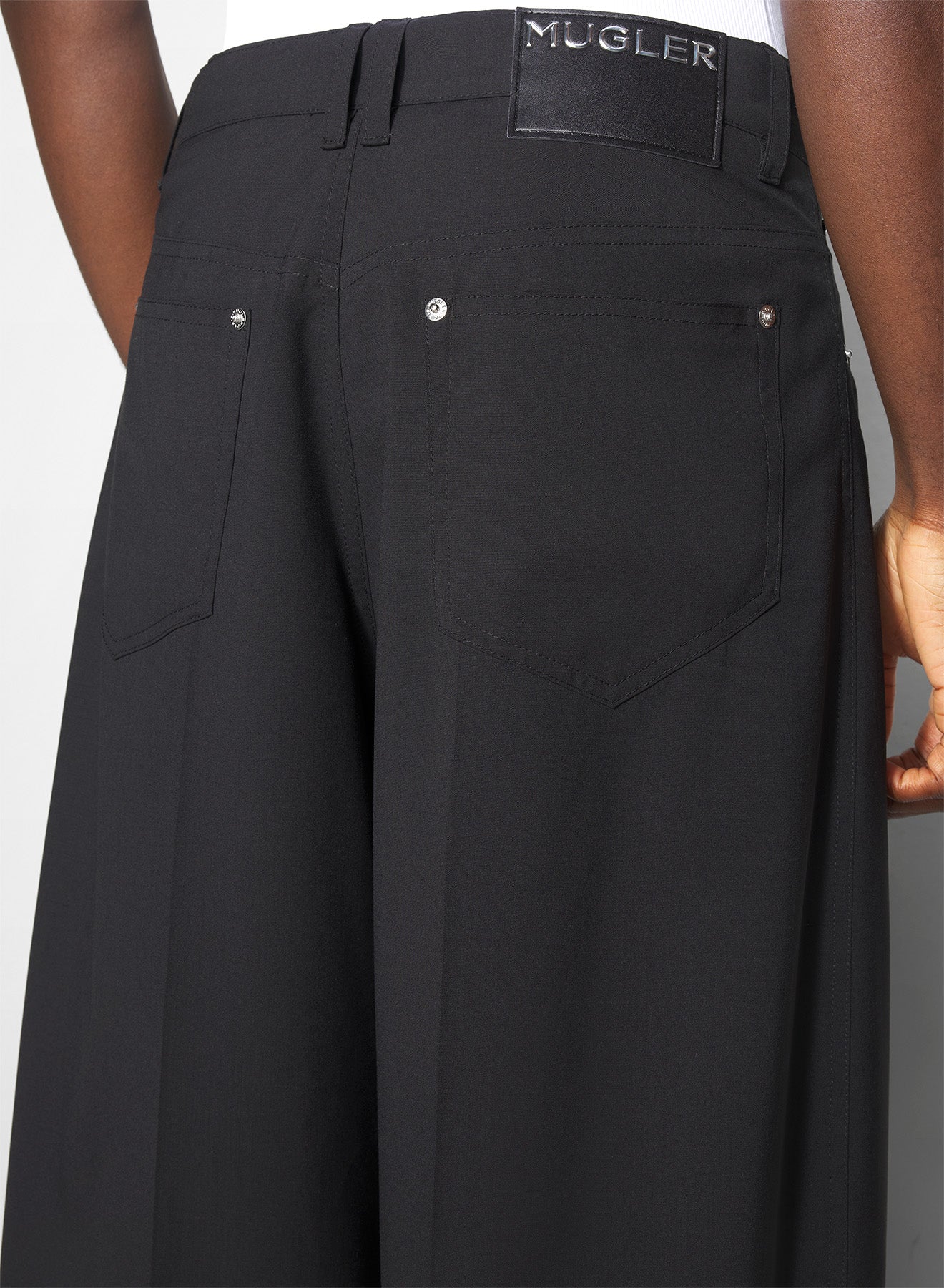 black asymmetric panel pants