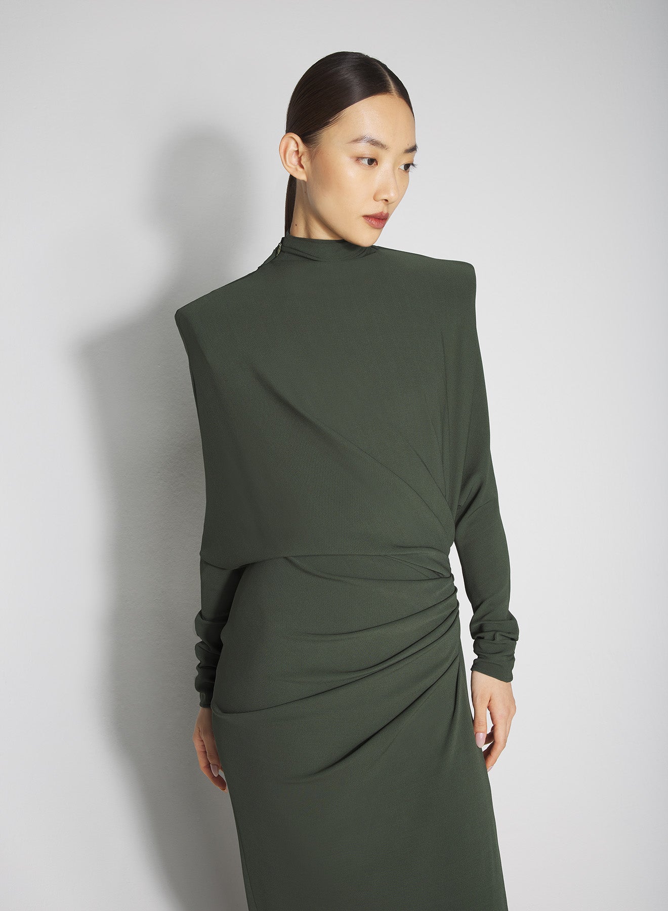 green draped open-back dress