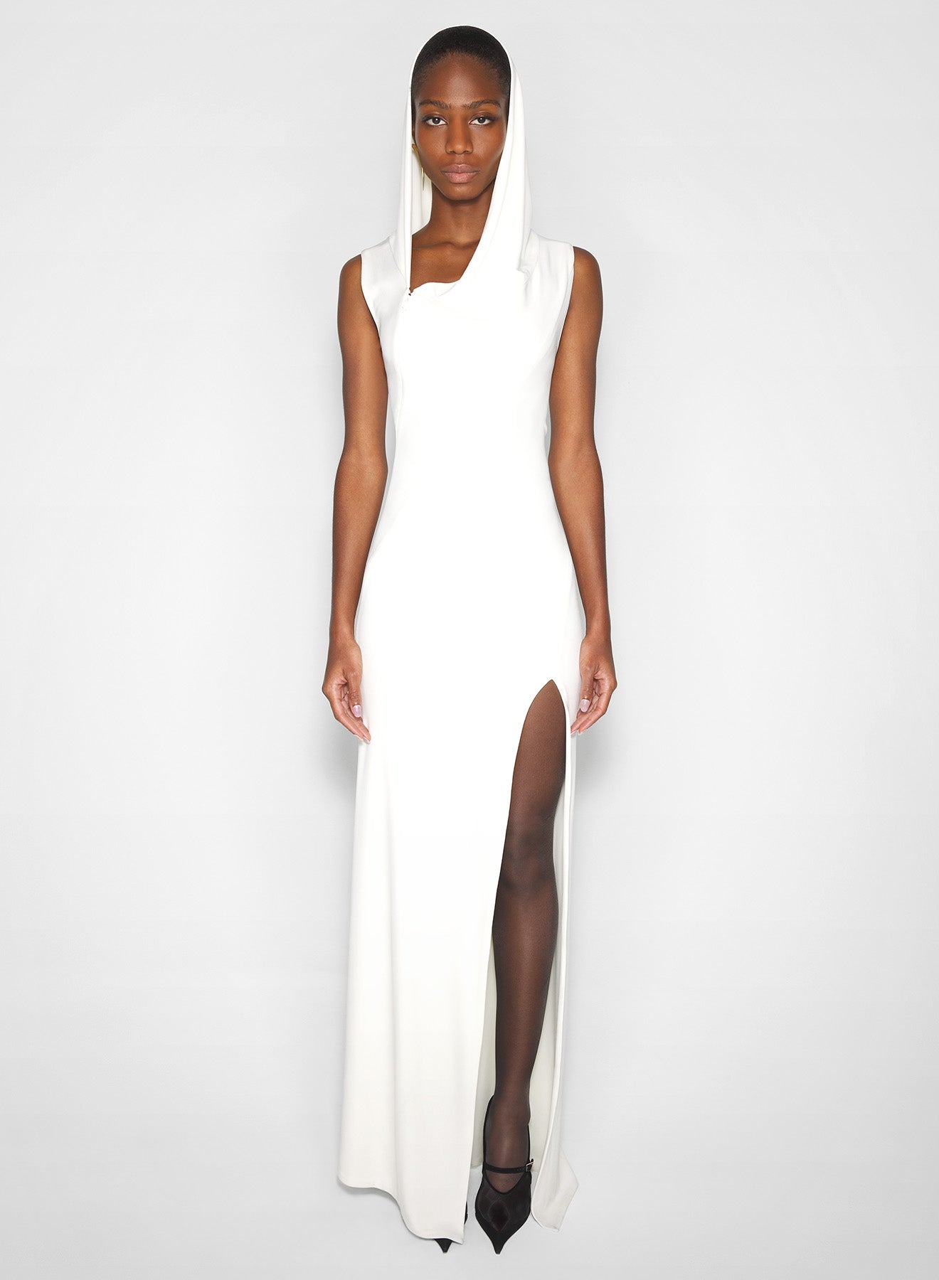 white hooded sleeveless gown