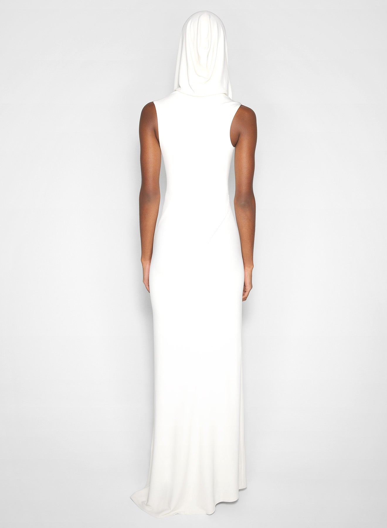 white hooded sleeveless gown