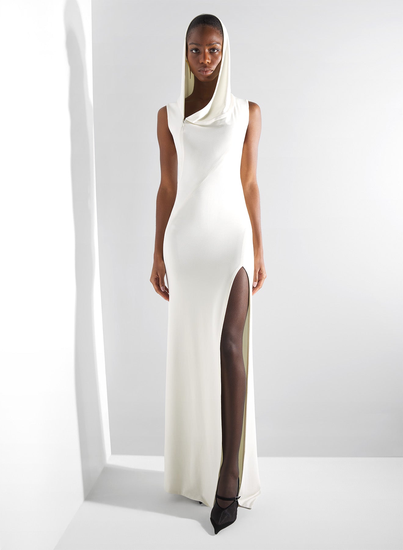 white hooded sleeveless gown
