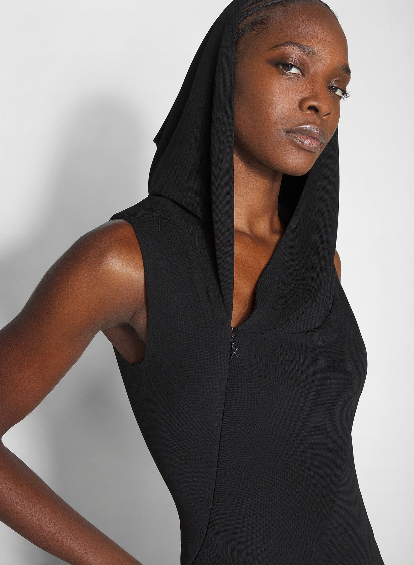 black hooded sleeveless gown