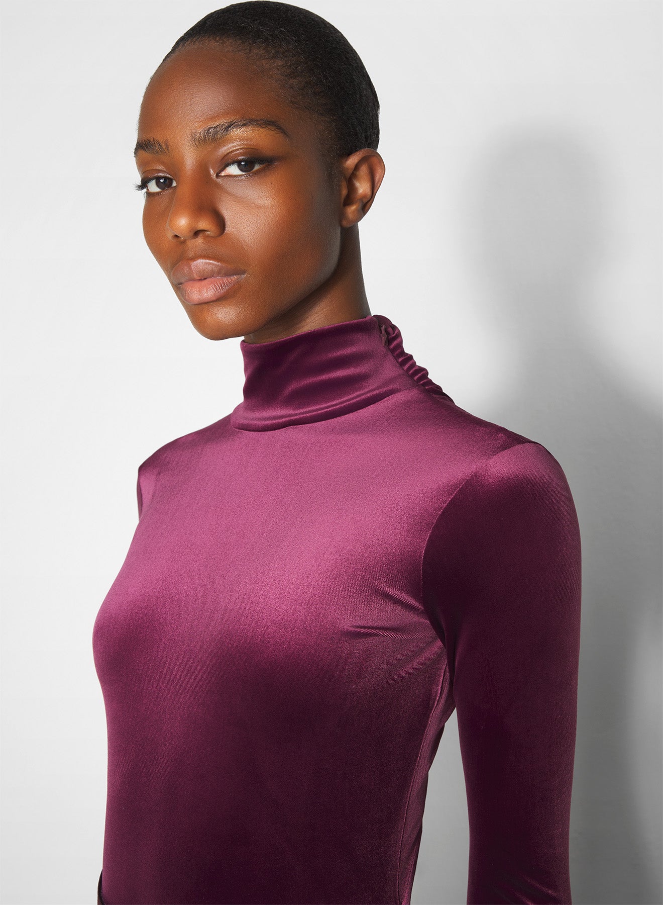 burgundy open-back velvet bodysuit