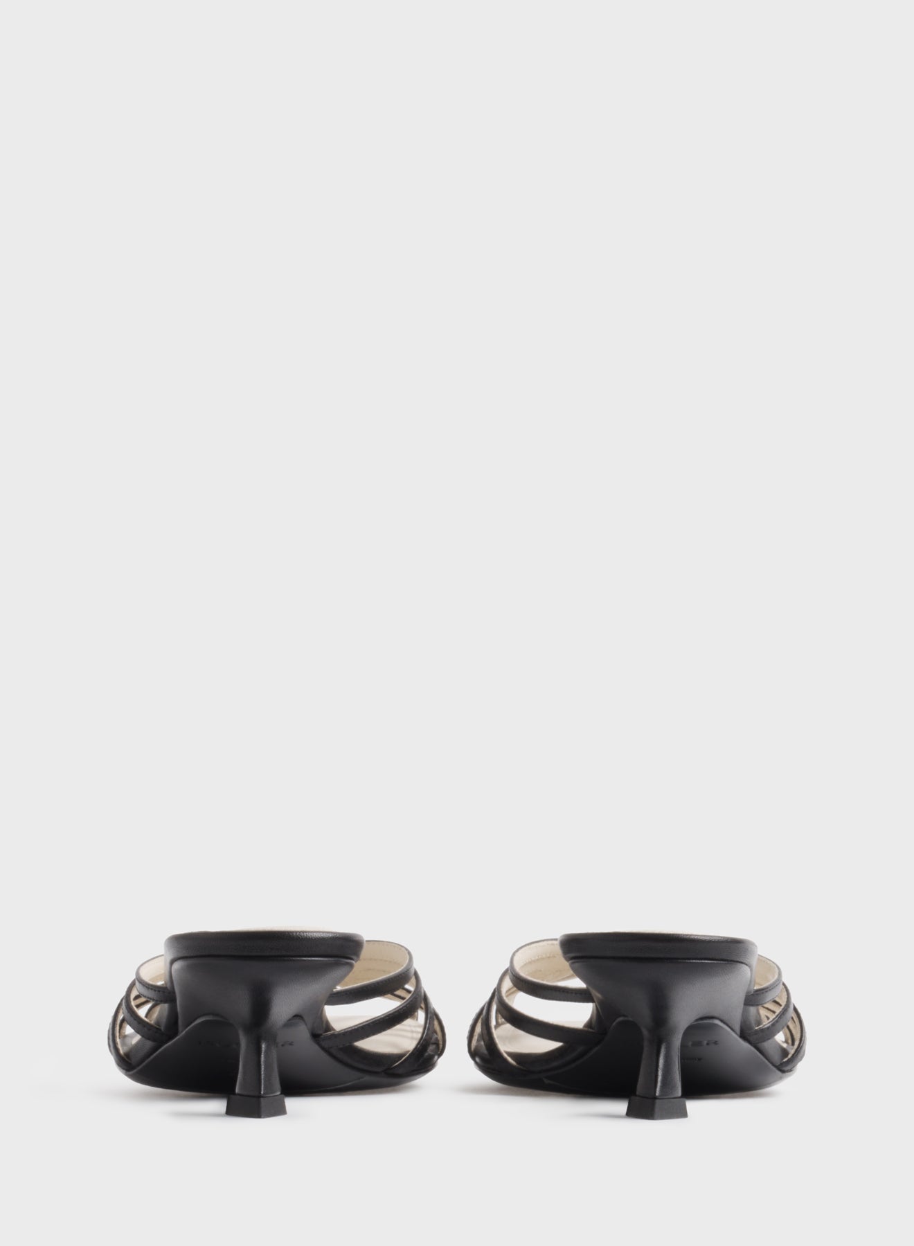 Black knotted strap mules 45