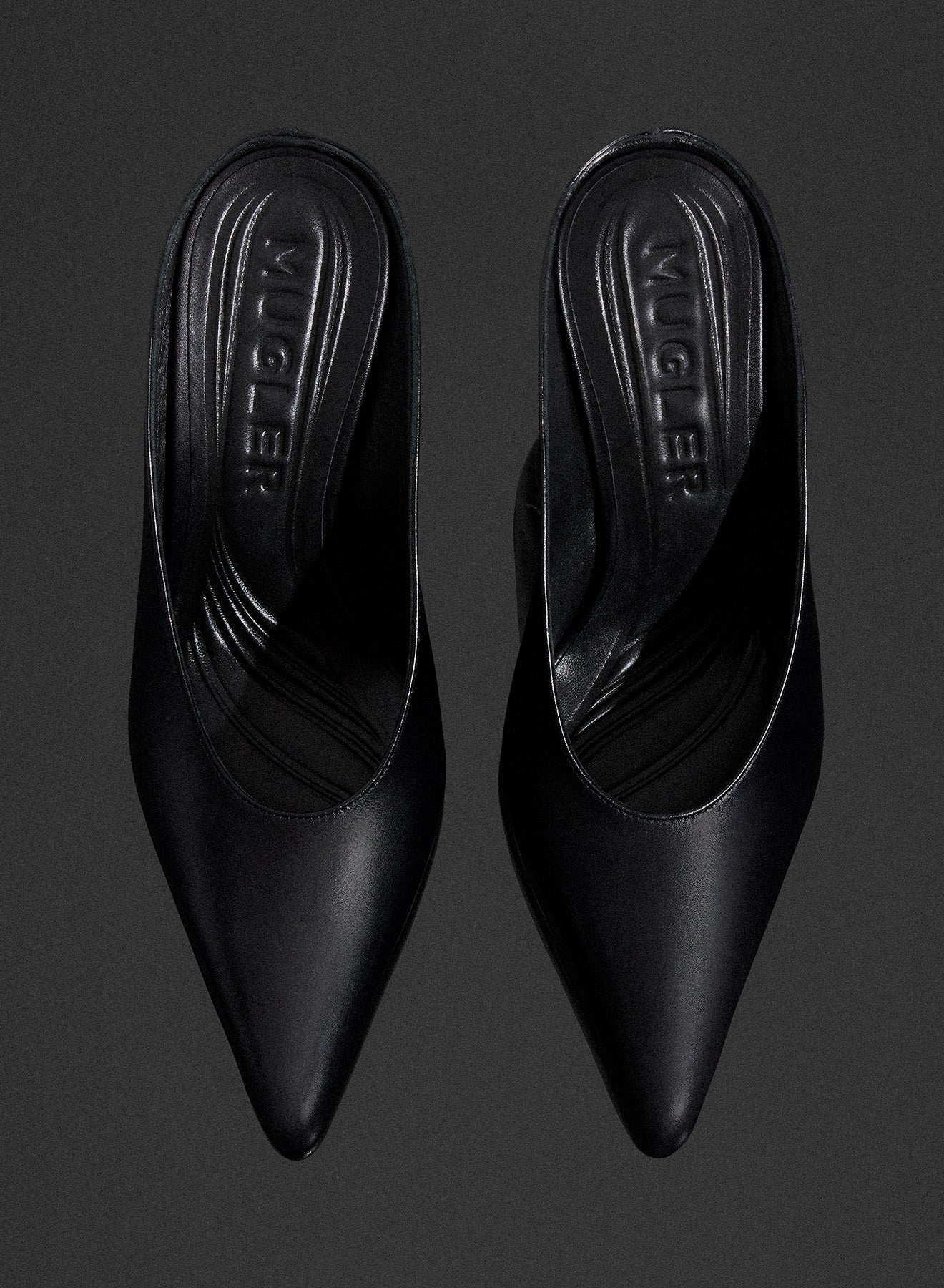 black curved heel mules