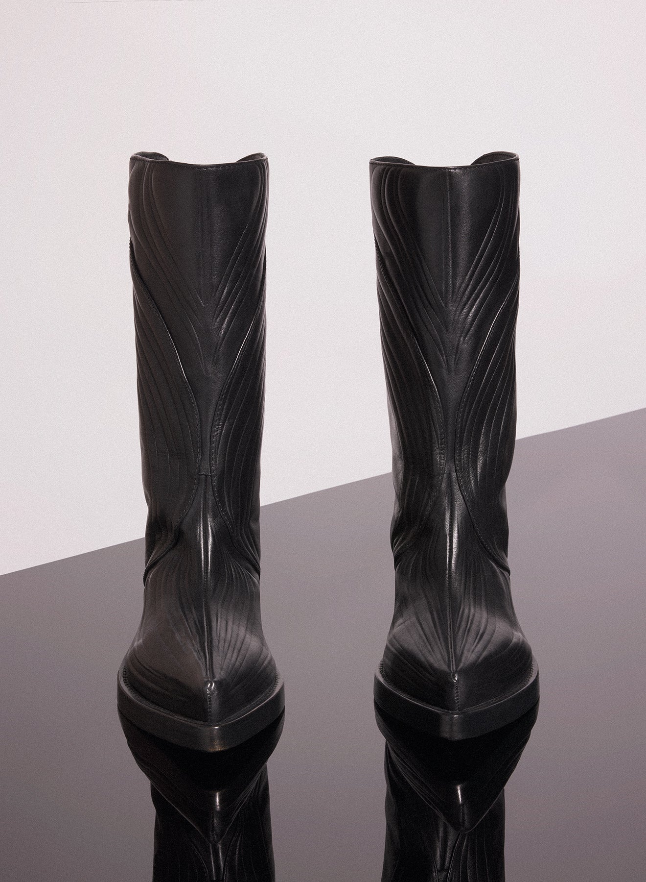 black embossed leather santiag boots