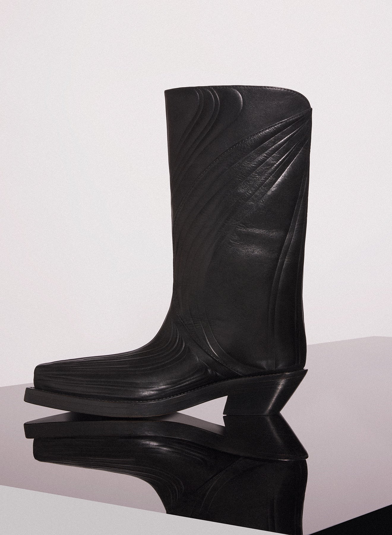 black embossed leather santiag boots