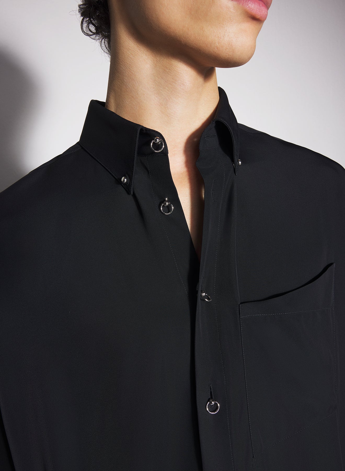 black fluid piercing shirt