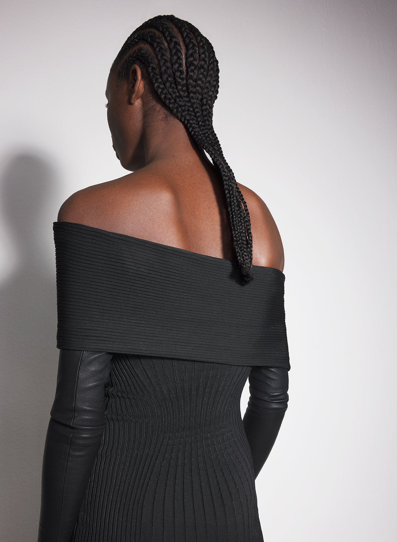 black off-shoulder sculpting knit dress