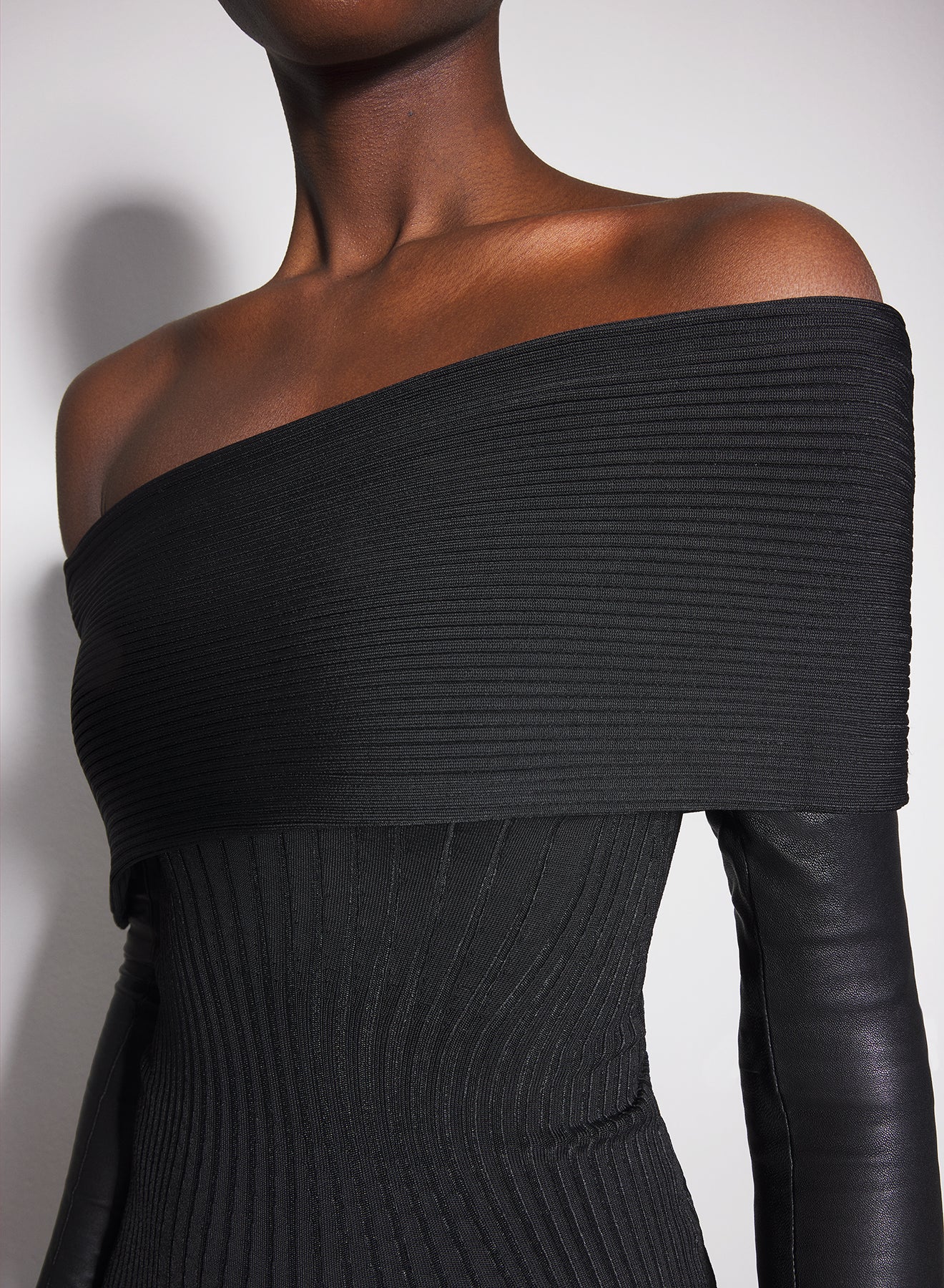 black off-shoulder sculpting knit dress