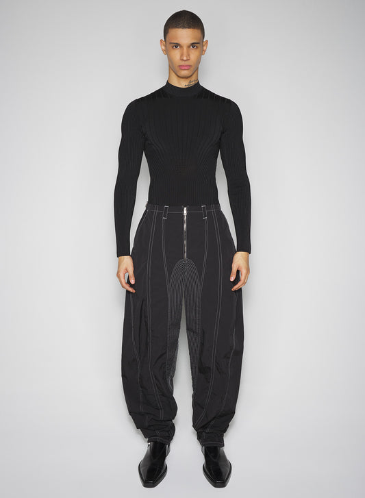 black stitched parachute pants