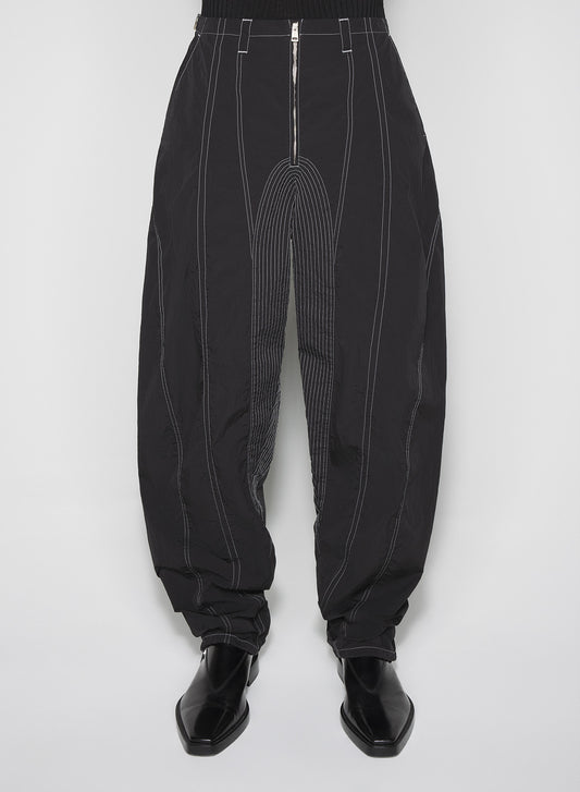 black stitched parachute pants