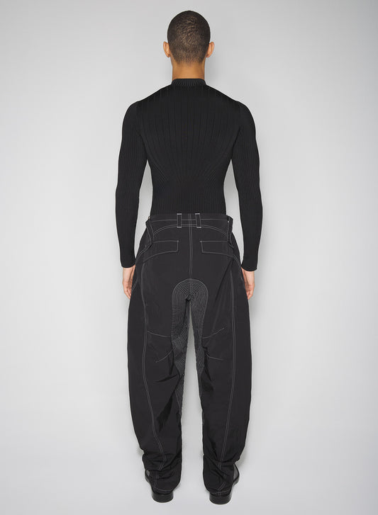 black stitched parachute pants