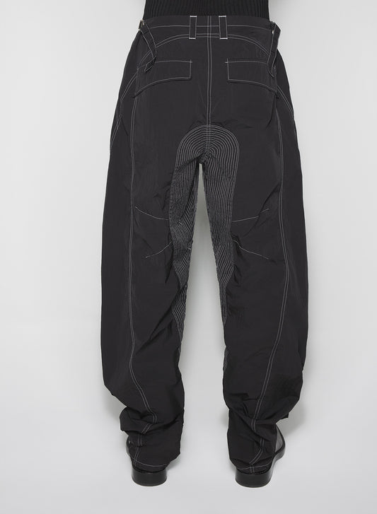 black stitched parachute pants