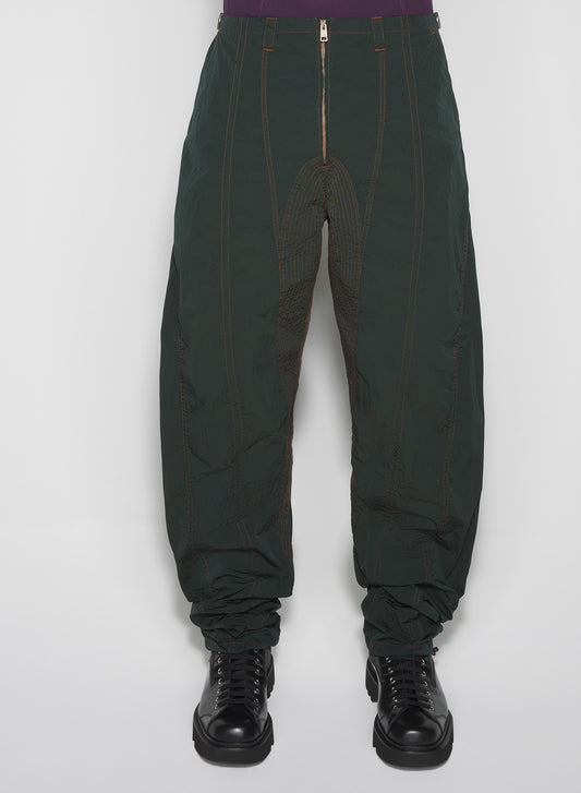 green stitched parachute pants