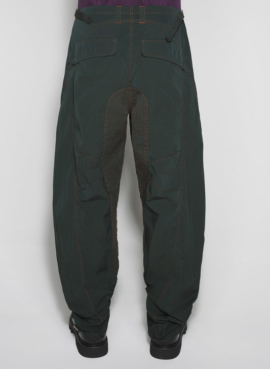 green stitched parachute pants