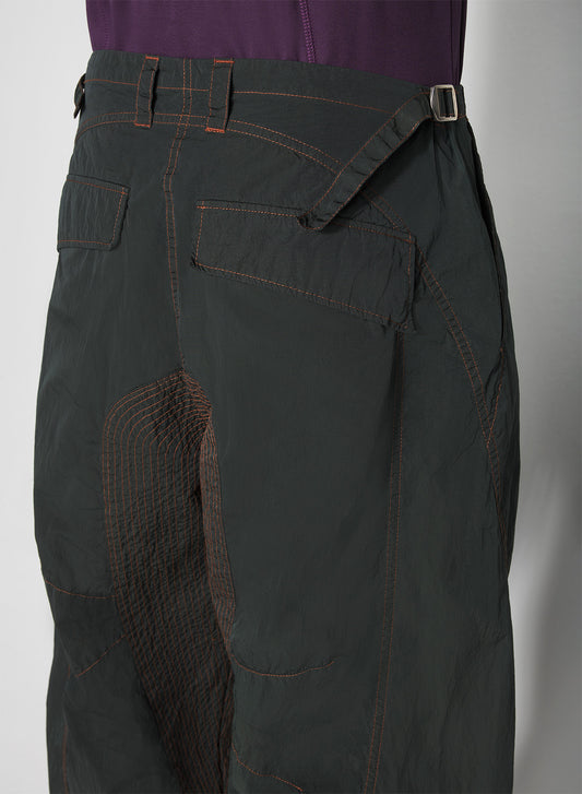 green stitched parachute pants
