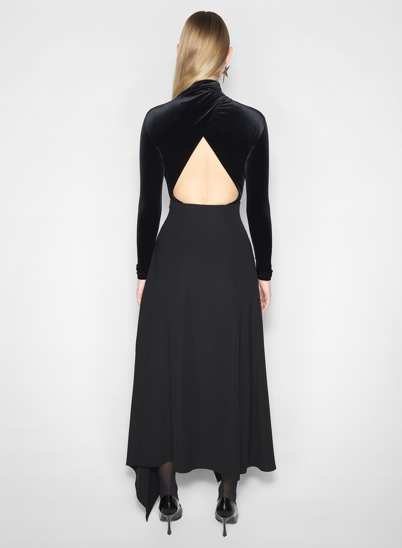 black open-back velvet bodysuit