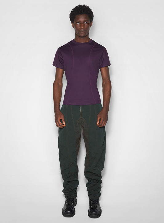 green stitched parachute pants