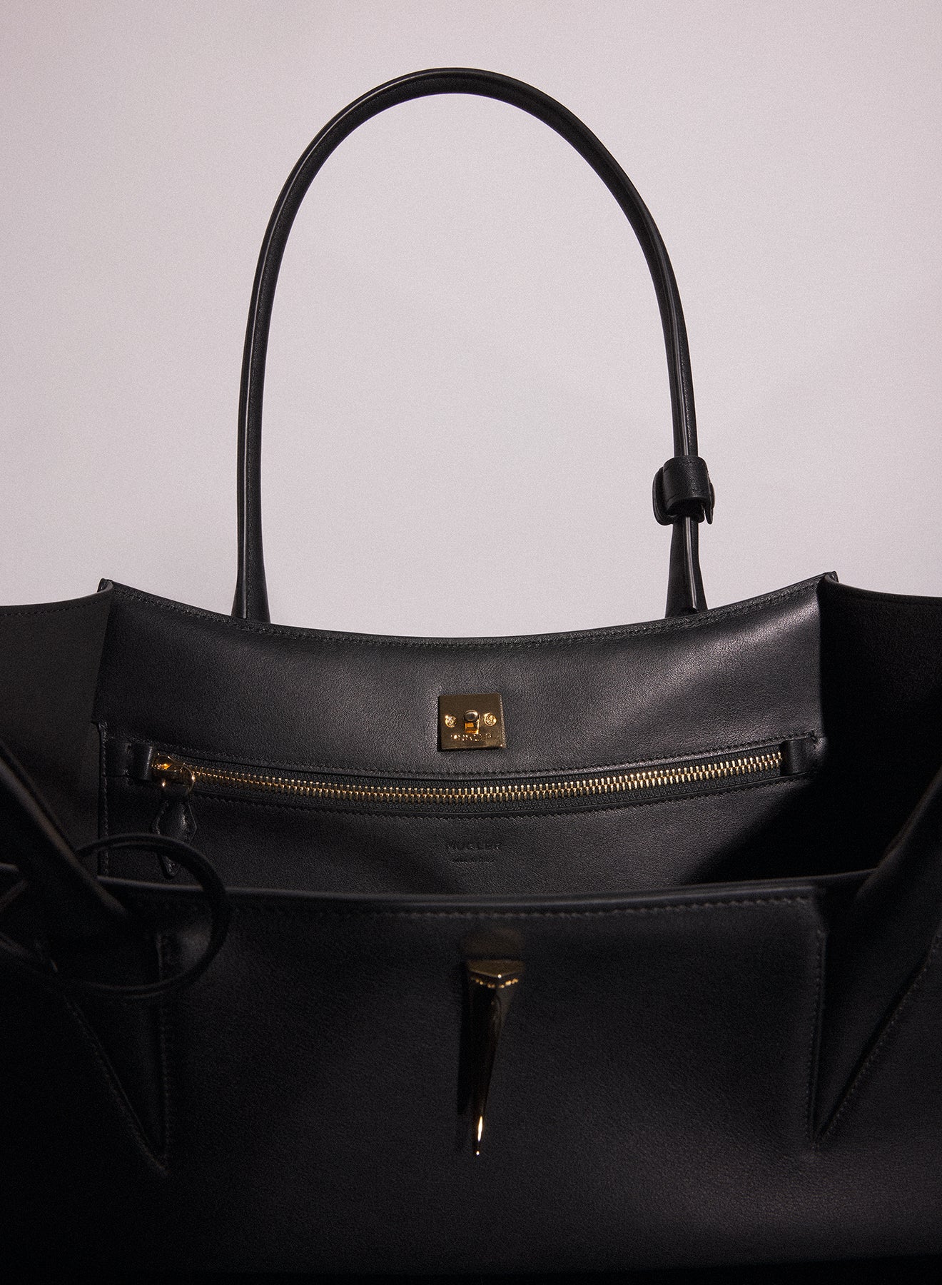 black smooth leather fang bag