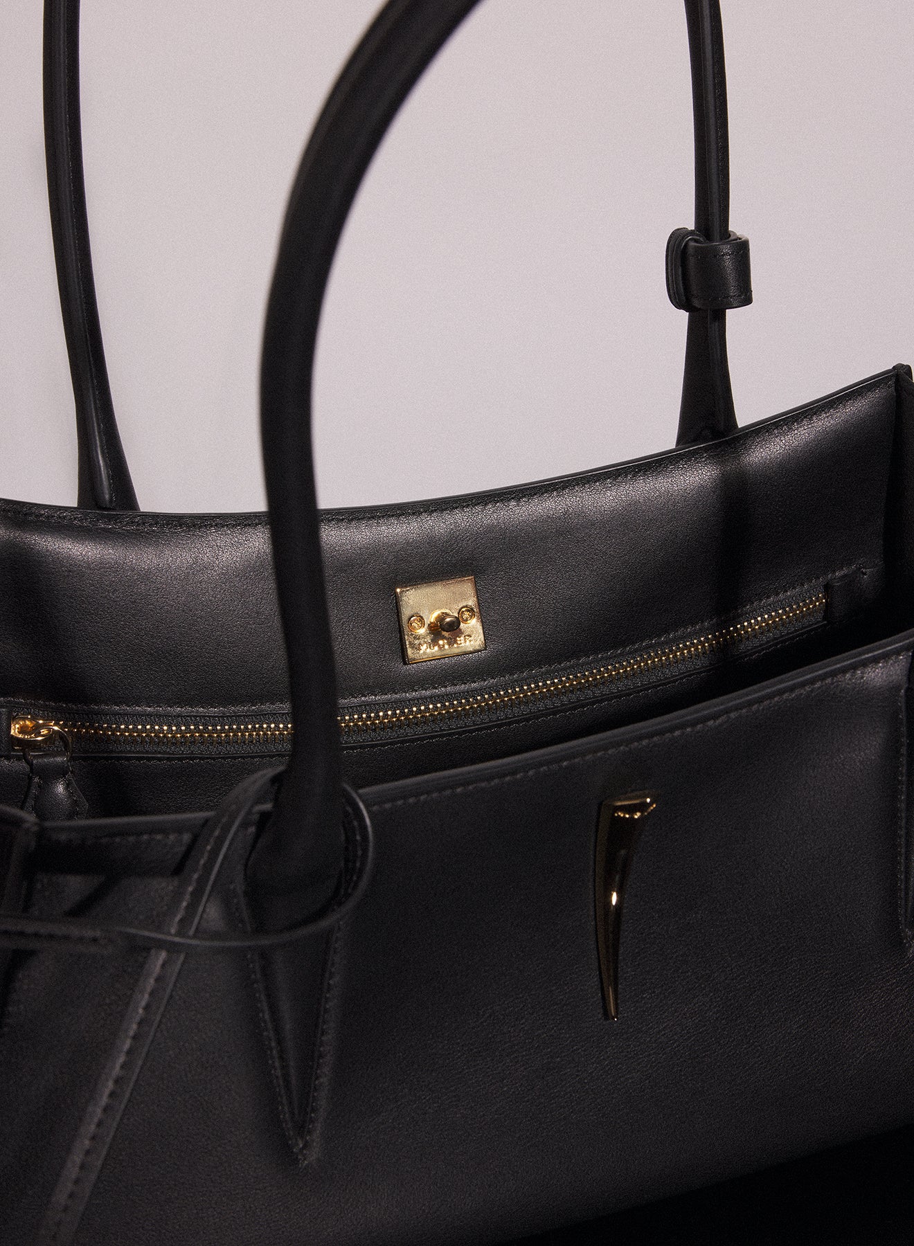 black smooth leather fang bag