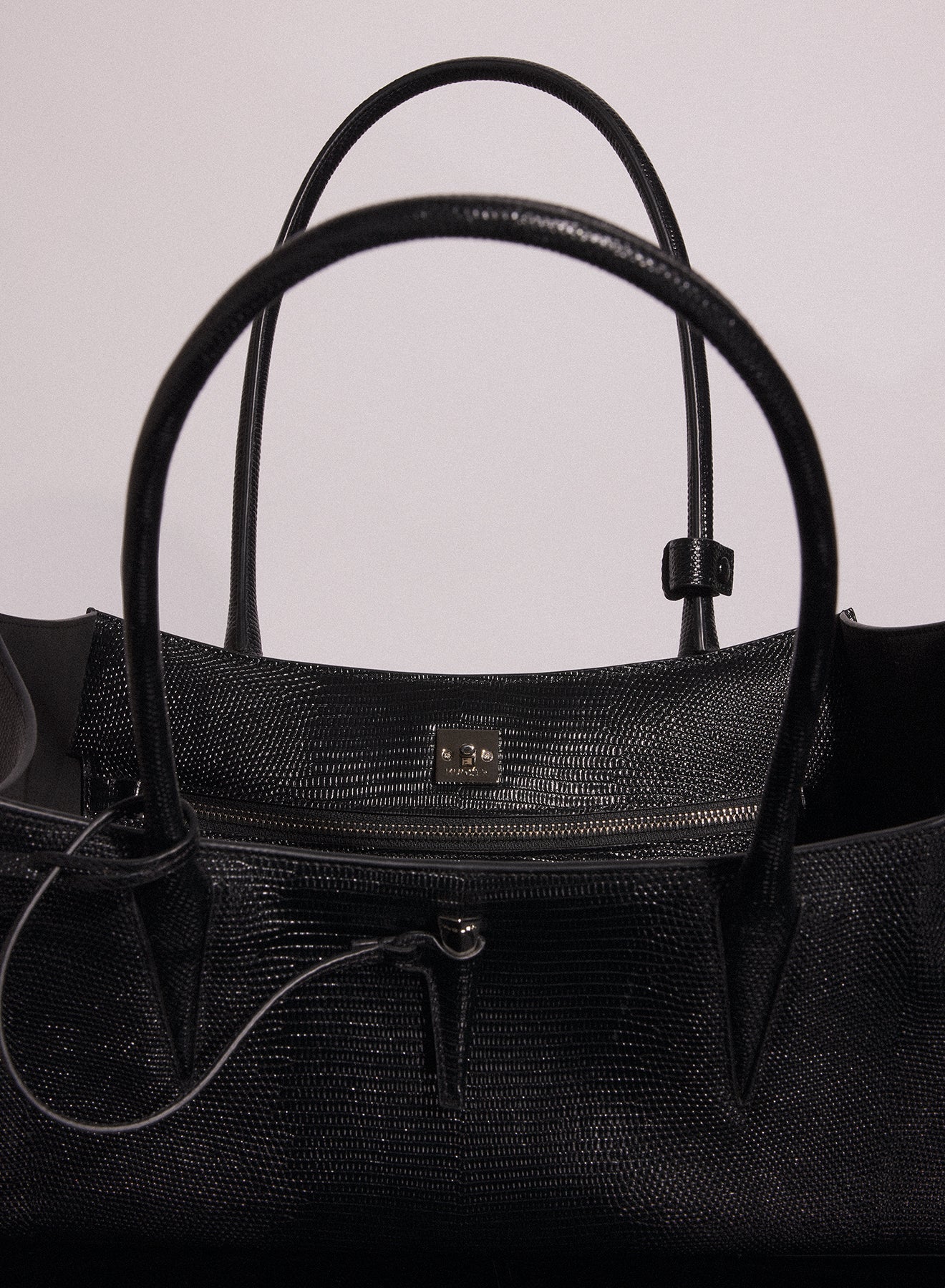 black embossed lizard leather fang bag