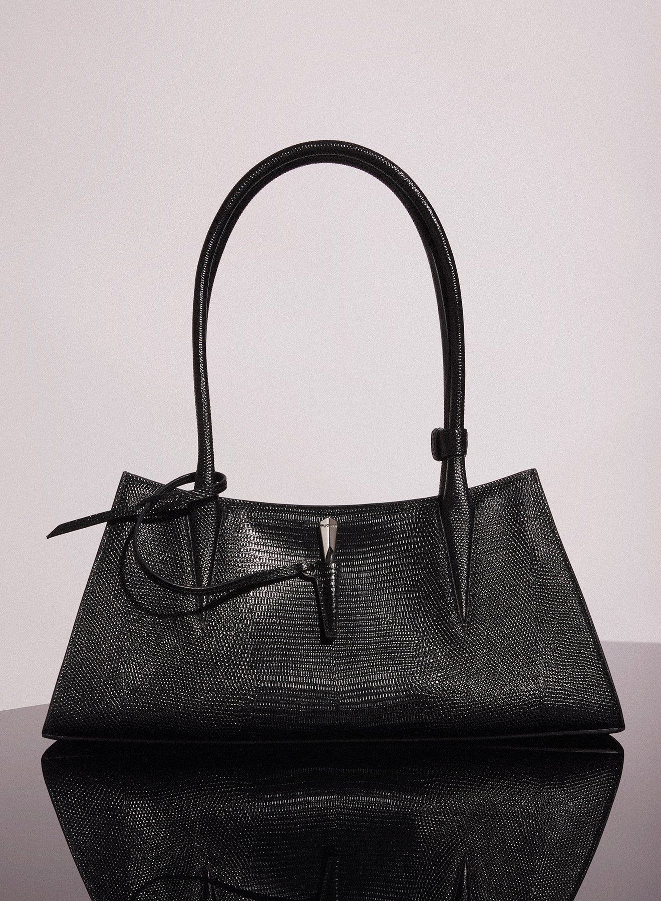 black embossed lizard leather fang bag