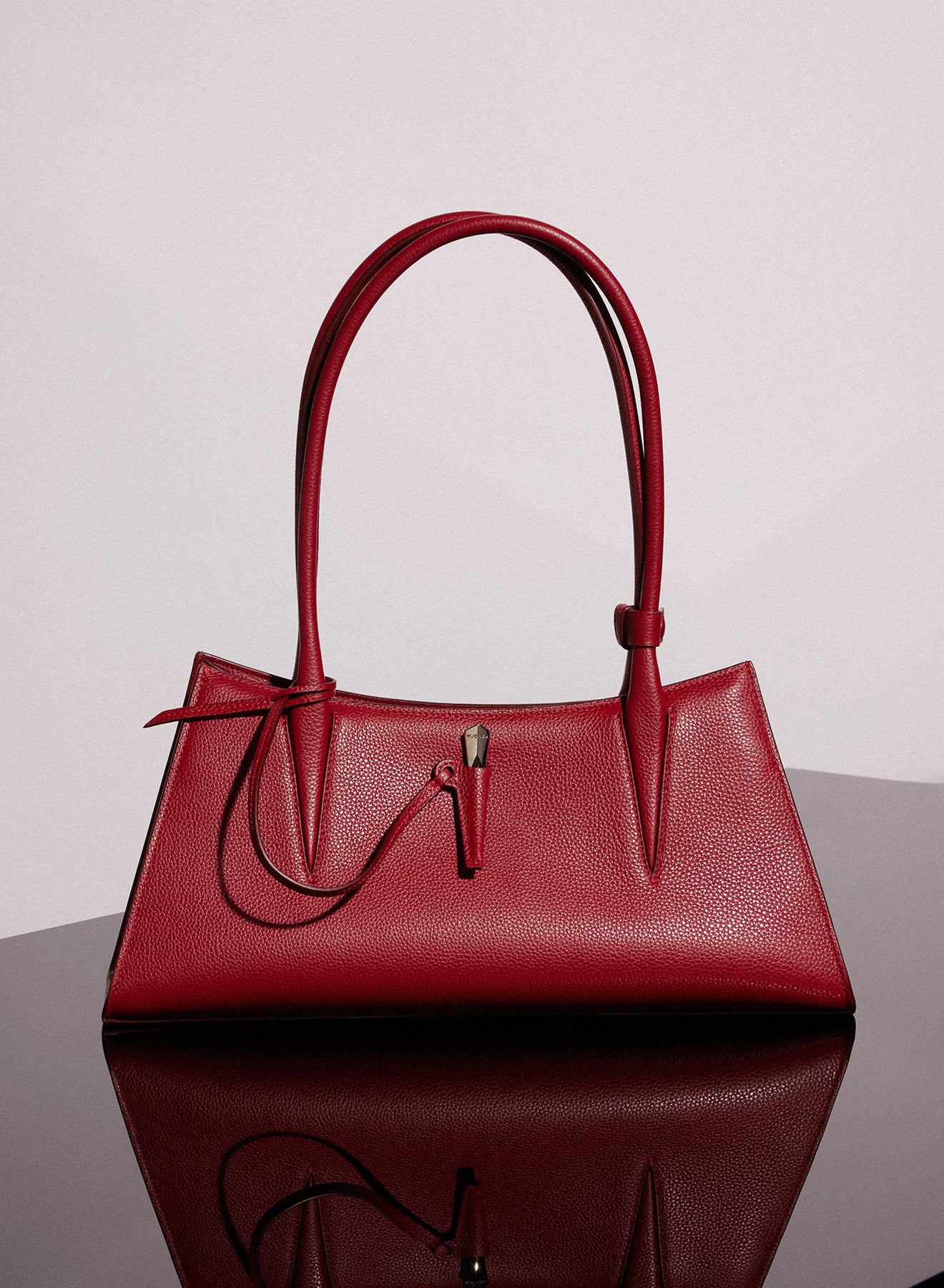 red grained leather fang bag