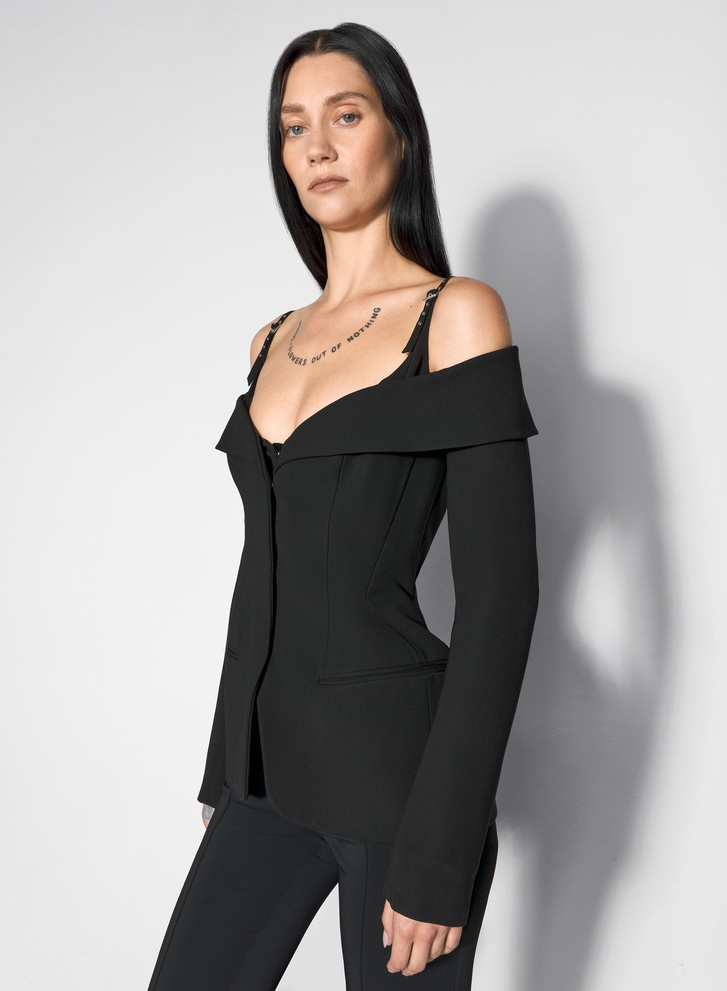 black sculptural off-shoulder jacket