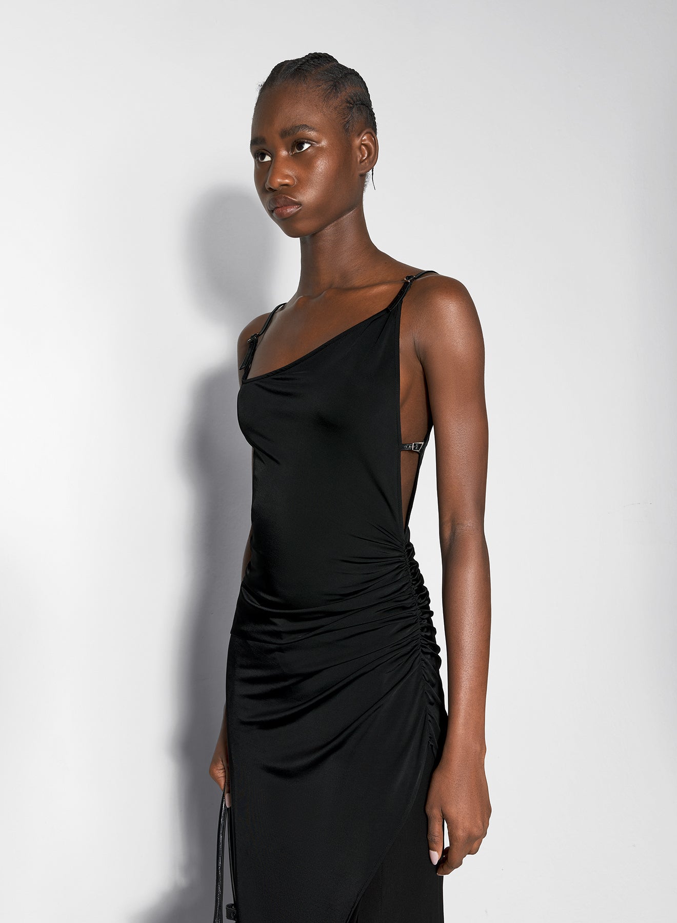 black asymetrical buckled strap dress