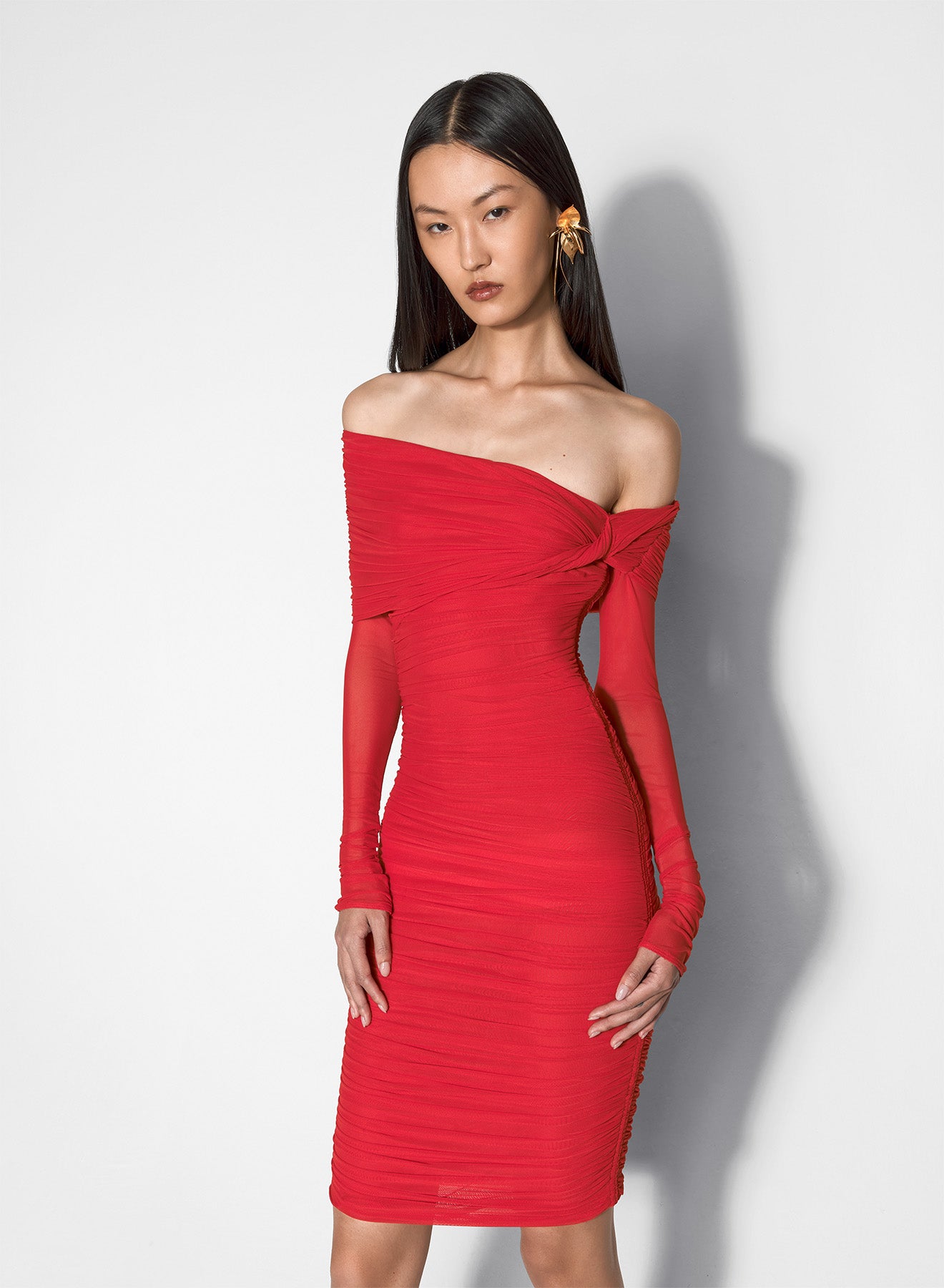 red off-shoulder ruched dress