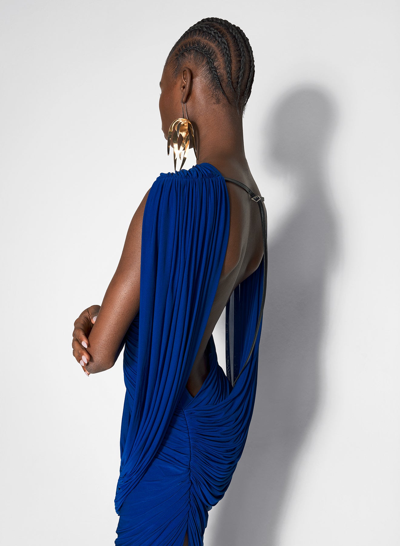 blue draped backless gown