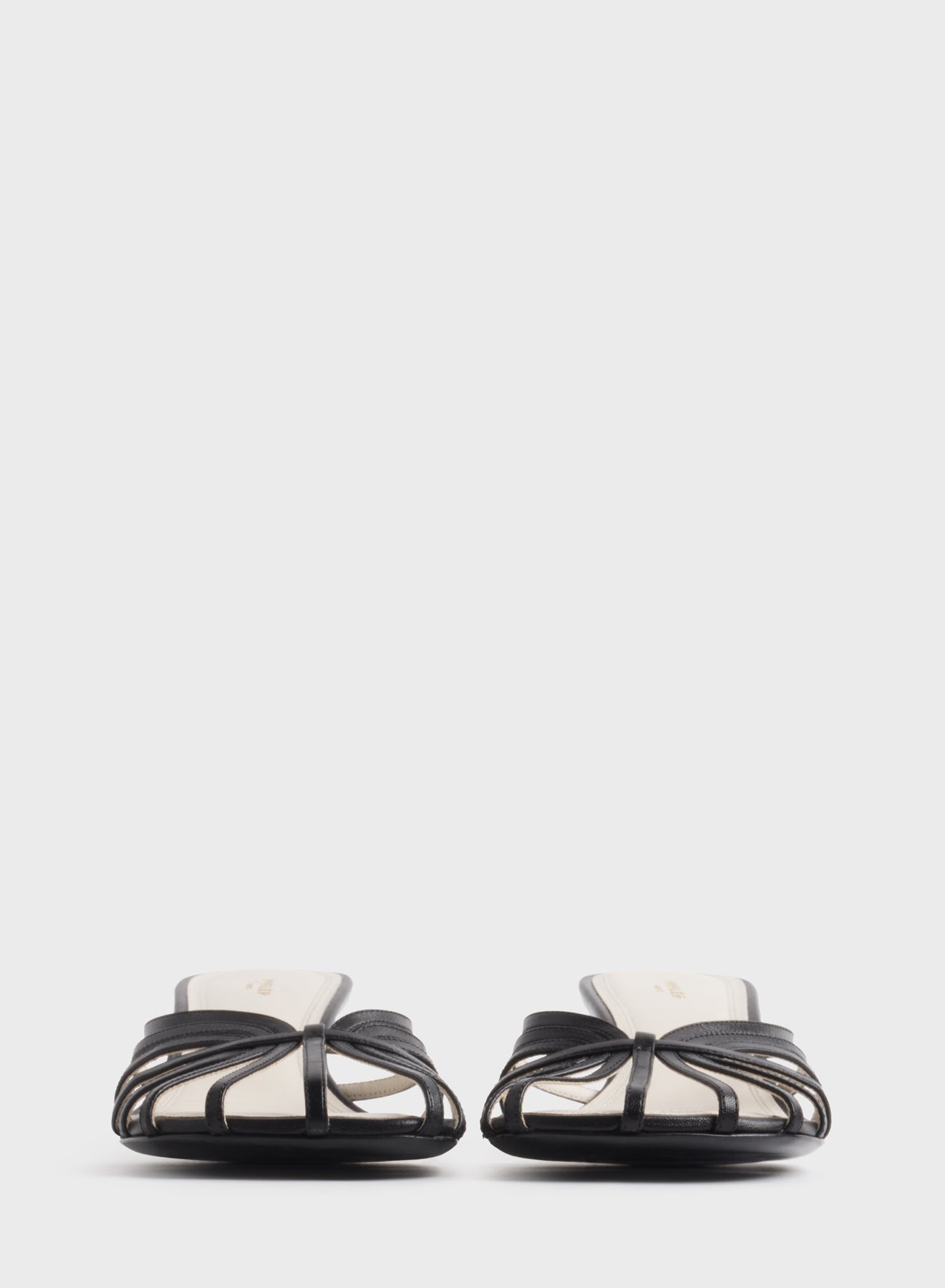 Black knotted strap mules 45