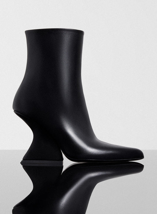 black curved heel ankle boots