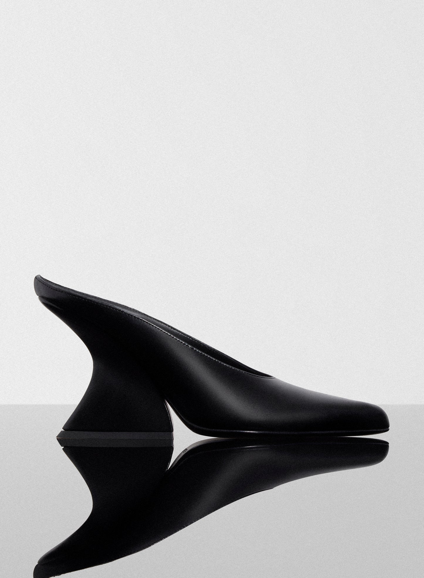 black curved heel mules
