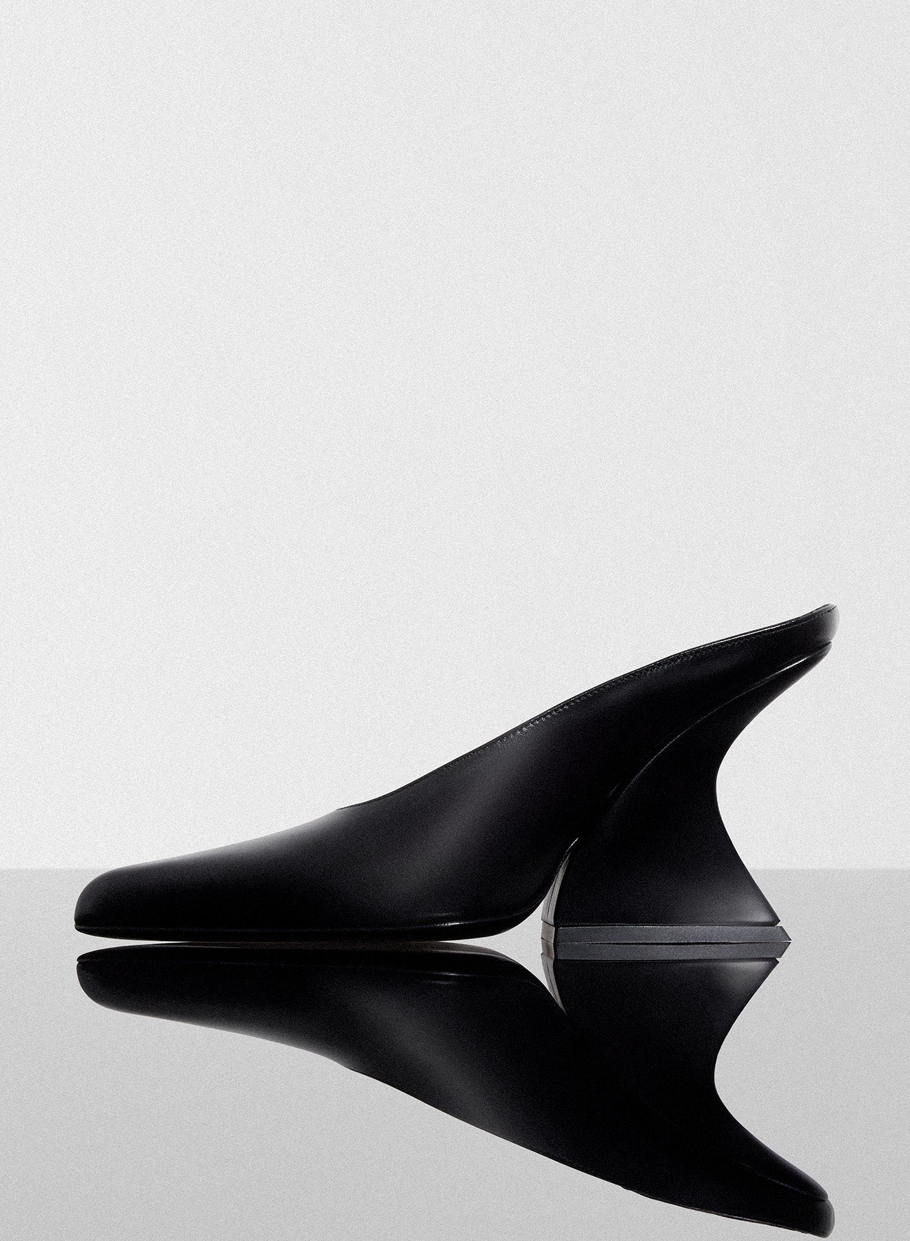 black curved heel mules