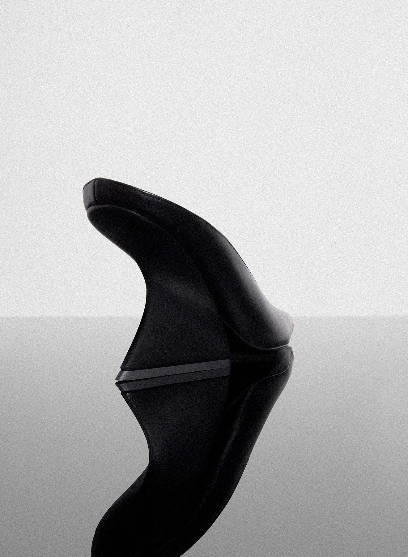 black curved heel mules