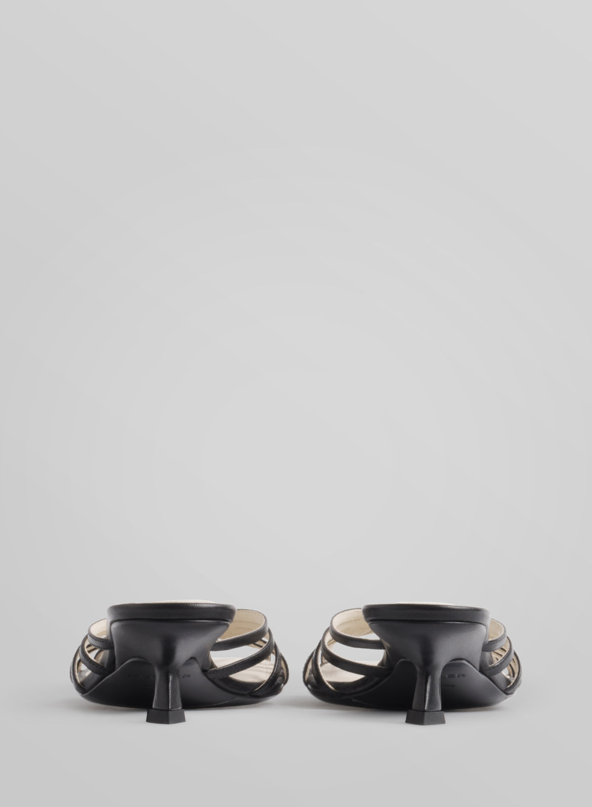 Black knotted strap mules 45