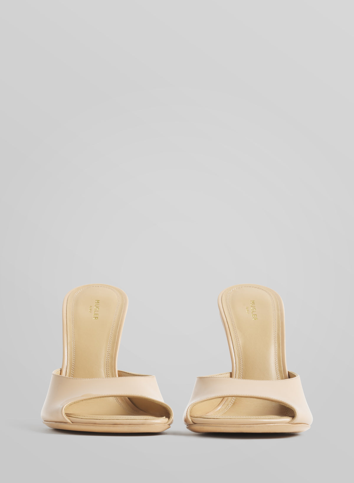 Tan peep-toe mules 105